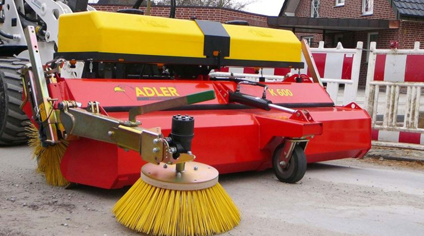 Sweeper K 600 with collection tank, side brush and water spray device as an option.